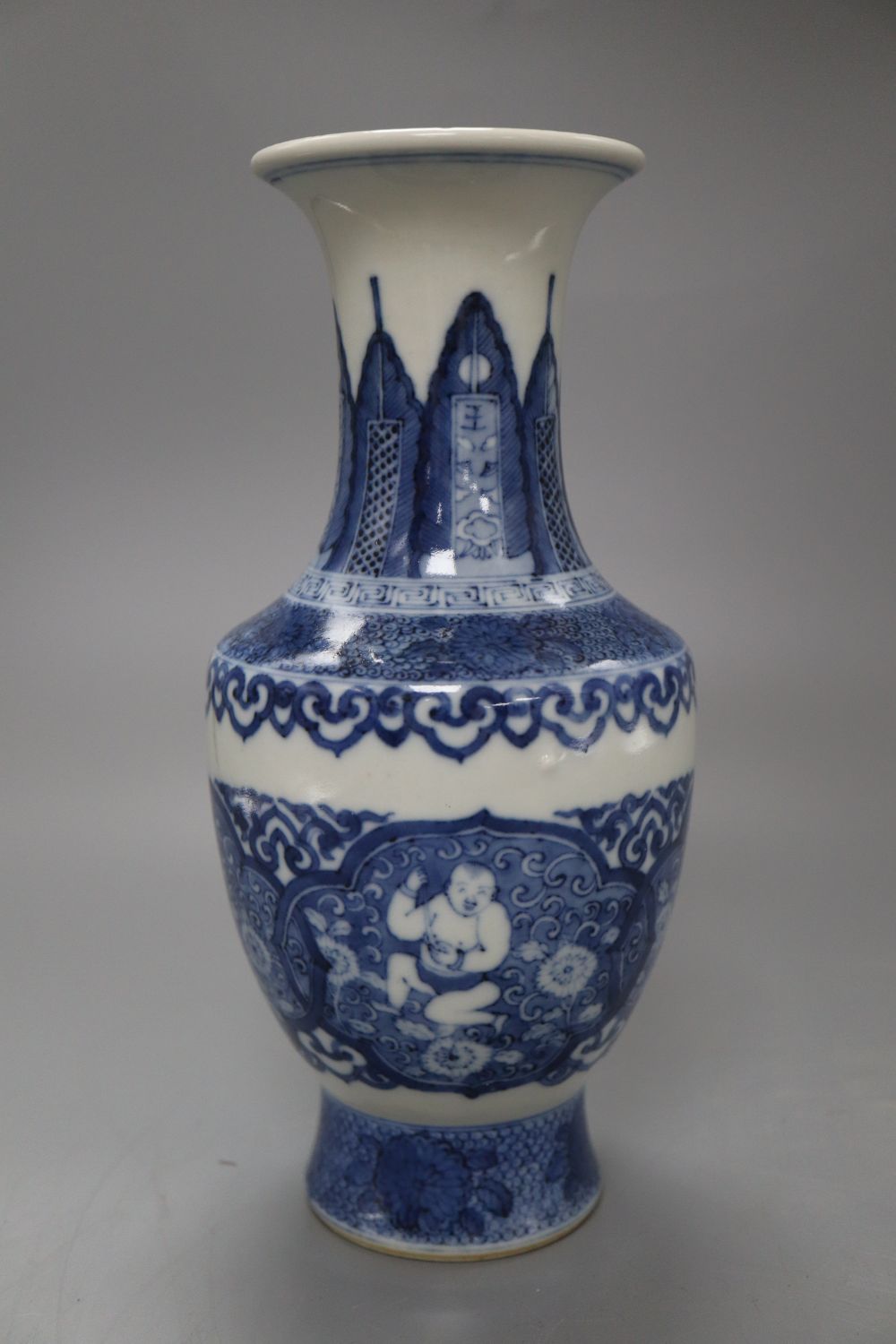 A Chinese blue and white bottle vase, bears Kangxi mark, height 22cm